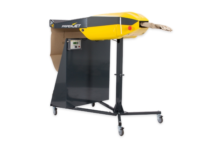 Gelber und grauer PaperJet® Papierfüllsystem auf schwarzem Ständer mit Rollen, vor weißem Hintergrund, zur industriellen Verwendung für Verpackungs- und Füllmaterial in Versandprozessen.